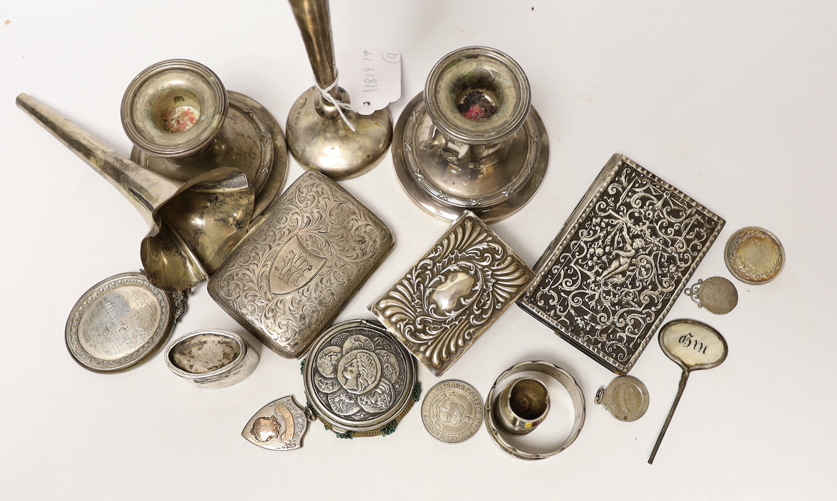 A modern pair of silver mounted dwarf candlesticks and other sundry silver items including cigarette case, medals etc.